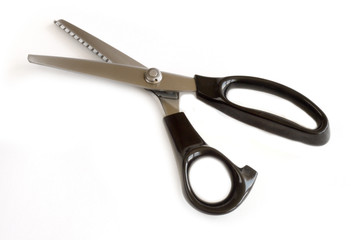 Tailoring scissorswith zigzag edges  isolated on white background