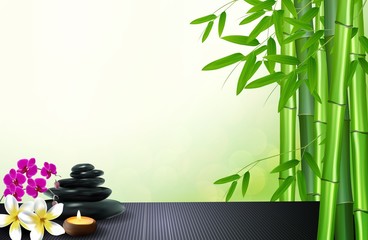 Bamboo, stone, flowers and wax background on the table