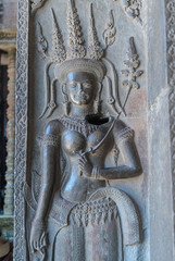 bas-relief of a devata in the archaeological place of angkor wat in siam reap, cambodia