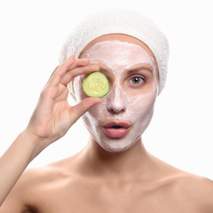 young woman with a face pack.