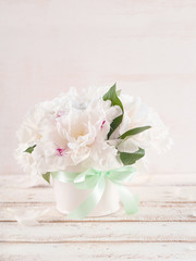 White peonies in vase