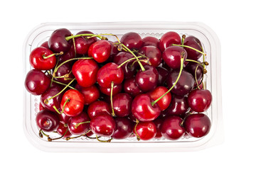 Box or punnet of fresh ripe organic cherries isolated on white background - 85234816