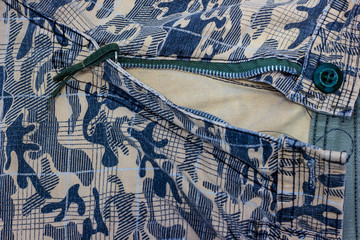 close up of fabric Military camouflage texture with open zipper