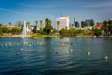 The Los Angeles skyline and the lake at MacArthur Park, in Westl