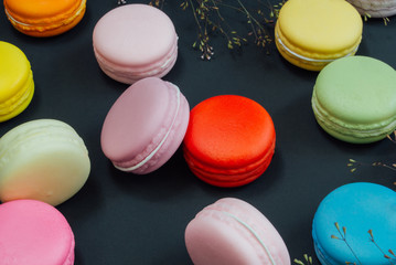 Macaron in a wooden box on black, Vintage tone