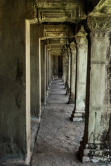 sight in perspective of a gallery and pillars in the archaeological place of angkor wat in siam reap, cambodia