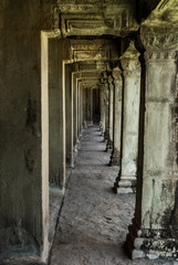 sight in perspective of a gallery and pillars in the archaeological place of angkor wat in siam reap, cambodia