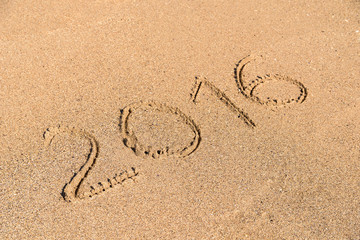 Fototapeta na wymiar Year 2016 Written On Beach Sand