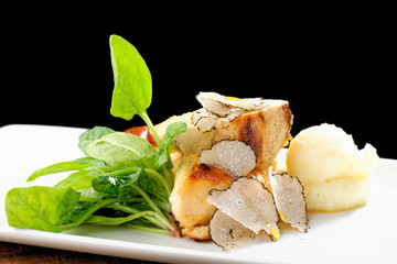 Fine dining mail course, grilled chicken breast with black truffles, quiche and potato purree