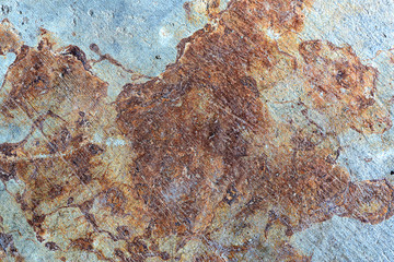 Brown grunge rust stains on polished old grey concrete floor