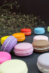 Macaron in a wooden box on black, Vintage tone