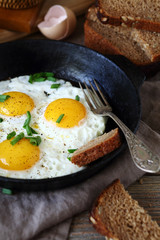 Delicious fried eggs in a pan