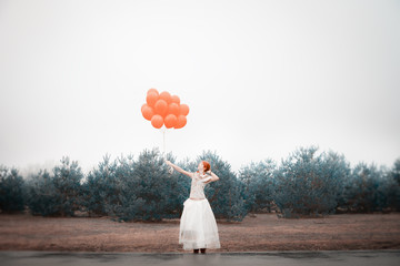 unusual woman with balloons as concept outdoors