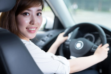 Asian beautiful woman driving car portrait