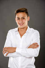 Fototapeta na wymiar young businessman isolated on gry