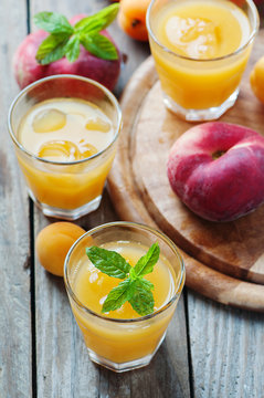 Sweet fresh peach juice with ice