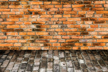 grunge background, red brick wall texture bright plaster wall and blocks road sidewalk 