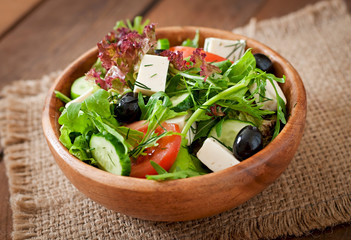 Very useful and diet salad of herbs, vegetables and feta cheese