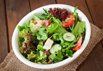 Very useful and diet salad of herbs, vegetables and feta cheese