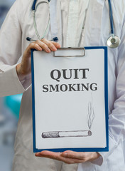 Doctor is warning and giving advice to quit smoking