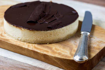 Fresh classic homemade Cheesecake with dark chocolate topping