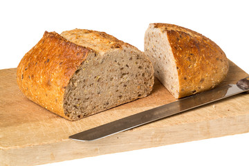 Artisan whole wheat bread on breadboard