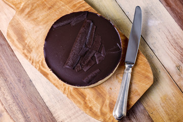 Fresh classic homemade Cheesecake with dark chocolate topping