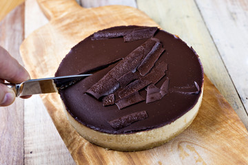 Fresh classic homemade Cheesecake with dark chocolate topping
