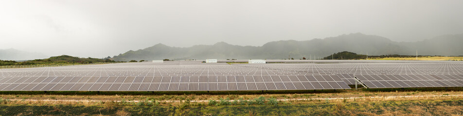 Solar panel power station on cloudy day