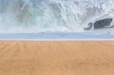 Sandy beach with waves in the distance