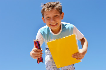 Happy student with books