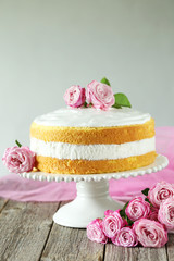 Obraz na płótnie Canvas Sweet cake on cake stand on grey wooden background