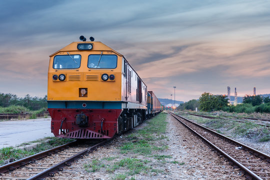 Fototapeta Cargo train and container at twilight
