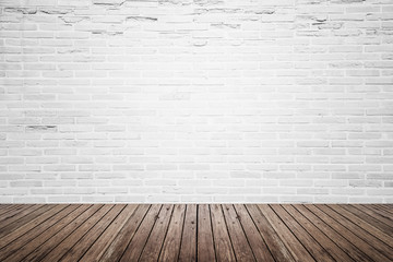 Old interior room with brick wall and wood floor
