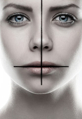 Portrait of a girl with a cross on the face, make-up cross, inverted cross, the symbol of St....