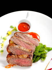 Roasted Kobe Marbled beef fillets with snow peas and tomato sauce