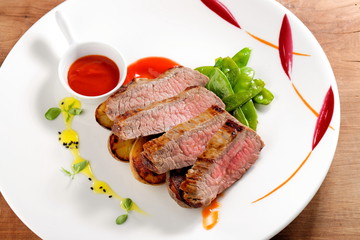 Roasted Kobe Marbled beef fillets with snow peas and tomato sauce