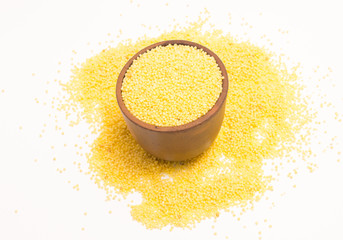 millet groats on the white background