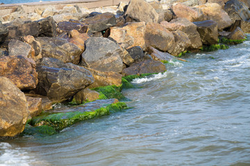 Seaside pier with large natural stones