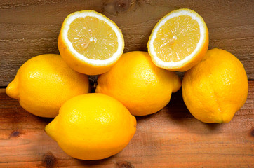 fresh lemons on rustic wooden market stall