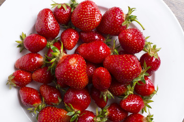 Strawberryes on white plate