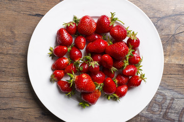 Strawberryes on white plate