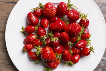 Strawberryes on white plate