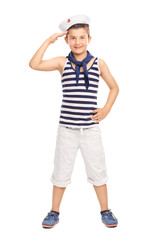 Cute little kid in a sailor uniform saluting