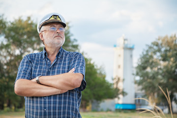 Elderly captain on the sea shore