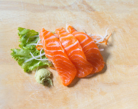 fresh sashimi saimon on wood background