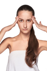 Fototapeta premium Beautiful young woman with headache touching her temples
