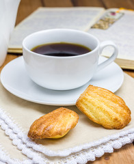 Homemade madeleines with a cup of coffee