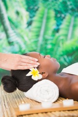 Obraz na płótnie Canvas Pretty woman enjoying a head massage