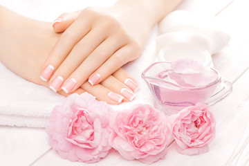 Obraz na płótnie Canvas french manicure with rose flowers. spa